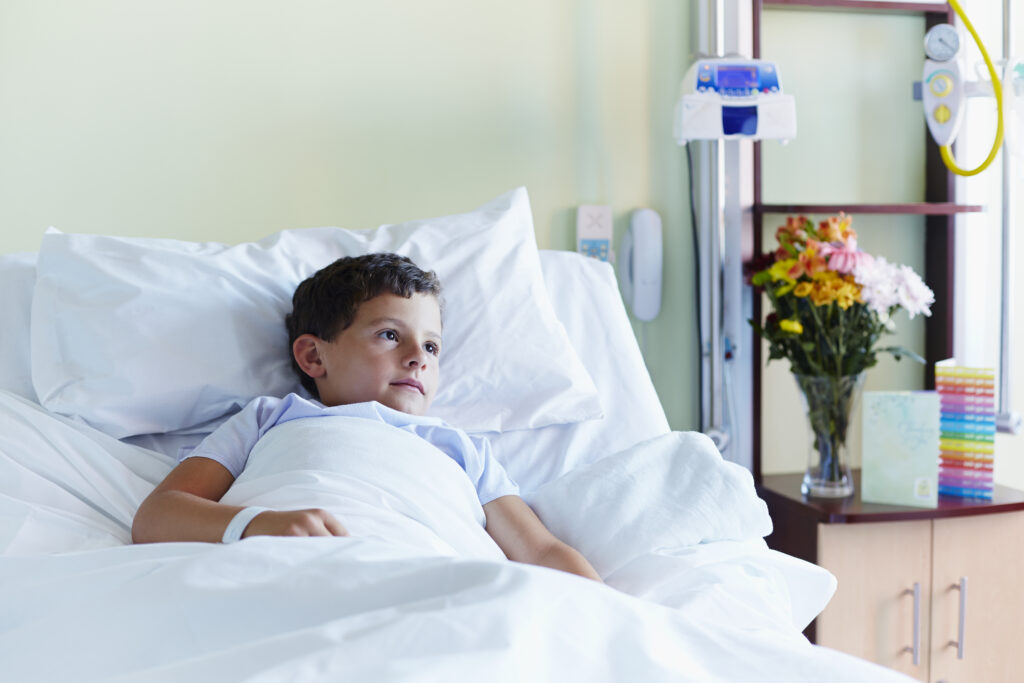 thoughtful boy relaxing in hospital